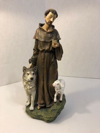 St Francis 9 1/2” Statue Holding A Bird Walking With A Lamb And A Wolf