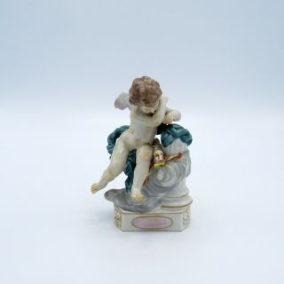 Antique Ackermann & Fritze Porcelain Cupid Figurine