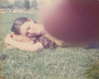 Abstract Vintage Photo Girl Sleeping In Park Finger Blur Over Camera Lens Art