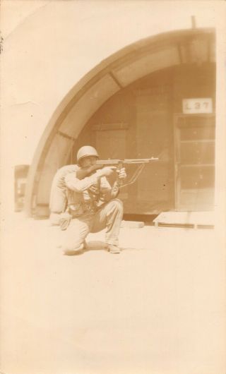 Vintage 1940s Snapshot Black White Photo Wwii Soldier Gun Shooting Kneeling