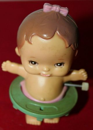 1977 Wind - Up Baby Girl - Arms Out - Stretched And Walking With A Green Walker