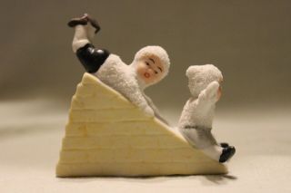 German Bisque Snow Babies On A Slide Figurine