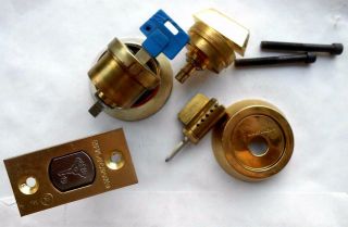 MUL - T - LOCK HIGH SECURITY LOCK CYLINDERS,  PARTS.  1 key work in 2 Cylinders 2