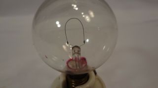 antique light bulb c6 miniature base machine turned early base.  Edison? Rare 2