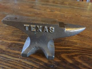 Vintage Brass Or Cast Iron Mini Anvil Marked " Texas " On One Side.