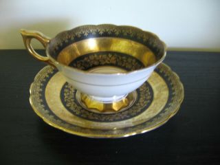 Royal Stafford Gold Black Pedestal Tea Cup And Saucer