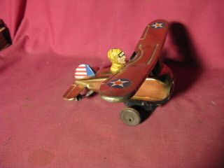 Vintage Louis Marx Tin Wind Up Looping Roll Over Airplane.