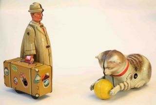 Two Vintage German Wind Up Tin Toys: Cat W/ Ball & Man W/ Suitcase