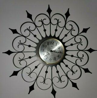 Vintage Welby Mid Century Modern Black Wrought Iron Atomic Starburst Wall Clock