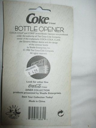 Coca cola die cast bottle shaped chrome plated opener in pkg. 2