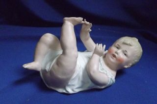 Antique German Gebruder Heubach 7 1/4” Piano Baby Doll Bisque Figurine Signed