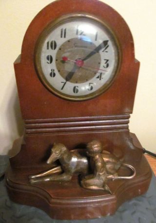 1940s Sessions Electric Clock Brass Boy & Greyhound Dog.  (ds950)