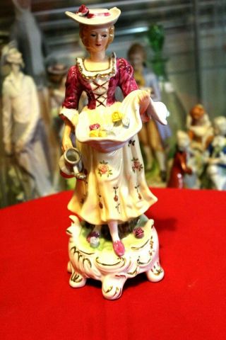 Collectible Old Dmco Porcelain Figurine,  Woman With Flowers.