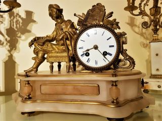 A 19th Century French Gilt And White Stone Figural Mantel Clock.