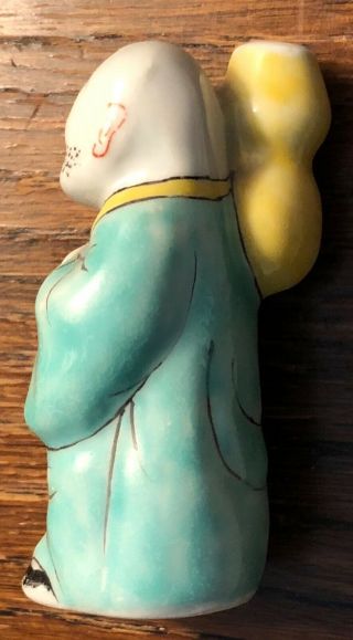 Vintage Chinese Porcelain Bottle In The Shape Of An Elderly Man Carrying A Jug
