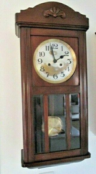 A 1930s Mahogany D.  R.  G.  M.  Chiming Wall Clock