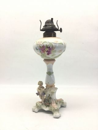 Antique Porcelain Oil Lamp With Putti Cherub Base