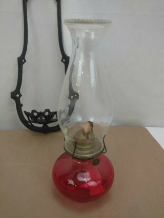 Vintage Oil Lamp and Cast Iron EMIG 12C Wall Hanger 2