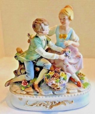 Bisque Porcelain Figurines Boy And Girl Exchanging Gifts