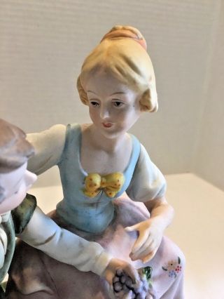 Bisque Porcelain Figurines Boy and Girl Exchanging Gifts 2