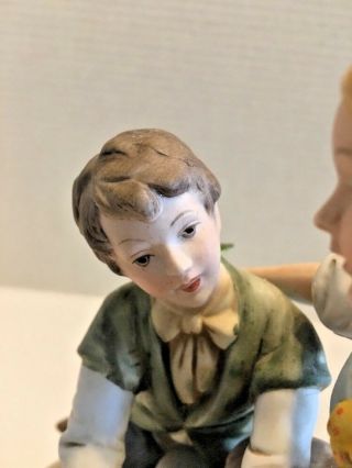 Bisque Porcelain Figurines Boy and Girl Exchanging Gifts 3