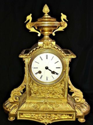 French Empire Gilt Bronze Mantle Clock By Douillon Circa 1830.