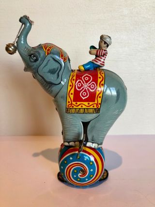 Vintage Tin Litho Wind Up Toy Circus Elephant On Ball W.  Rider.  Japan.  Perfect
