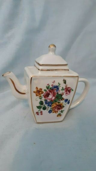 Miniature Porcelain Teapot White With Gold Decorations And Bouquet 3in Tall