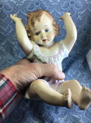 Vintage Bisque Porcelain Piano Doll Sitting Arms Up Baby Girl Figurine 7” X 5”