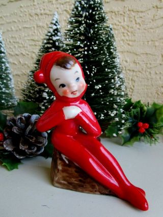 Vintage Ceramic Elf/pixie Red Suit Sitting On Log Legs To The Side Figurine Rare