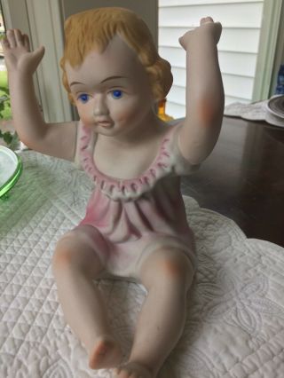 Vintage Bisque Porcelain Piano Doll Sitting Baby Girl Pink Figurine