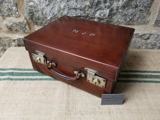 A Vintage Leather Suitcase By H.  Sismor
