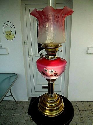 A Cranberry/pink 23 " Tall Victorian Twin Duplex Table Oil Lamp.