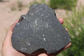 impact melt meteorite NWA end cut 497.  2 grams under classification 2