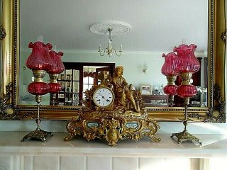 A Fine Quality Cranberry Victorian Style Peg Oil Lamps.