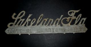 Vintage Auto License Plate Topper Emblem Sign (lakeland City Of Hearts Desire)