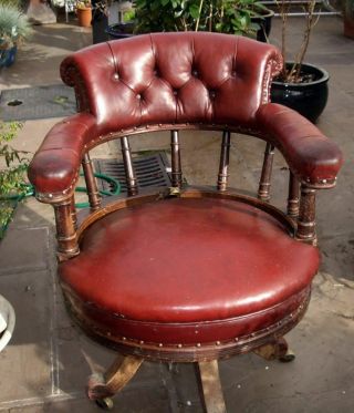 Antique Oak And Leather Revolving Chair