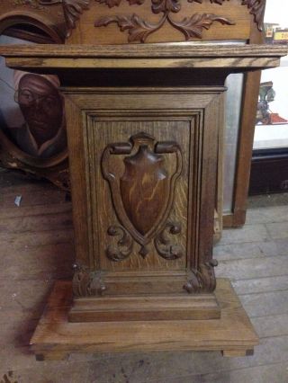 Antique Solid Oak Pedestal Stand W/ Ornate Shield Emblem
