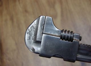 Antique 5 - 1/2 " Adjustable Bicycle Wrench,  Leprechaun Logo,  1/4 " Jaws,  1 - 1/2 " Cap.