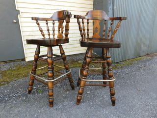 2 Vtg Bent Co Dark Tavern Pine Captain Chair Windsor Bar Stools Brass Foot Rails