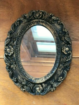 Vintage Small Oval Mirror In Black & Gilt Ornate Floral Plastic Frame – 9 X 7 In
