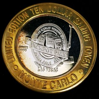 1998 G Monte Carlo Casino.  999 Silver Strike $10 Jackpot Pale Game Token,  Mc9849