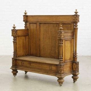 A Continental Carved Oak Settle,  19th Century (1800s)