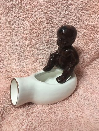 Vintage Black Memorabilia Baby Sitting On Ceramic Item - Urinal ?? Ash Tray ??