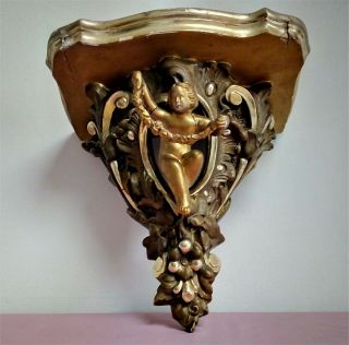 Antique Rococo Style Cherubic Figure Gilt Wood And Plaster Wall Bracket.