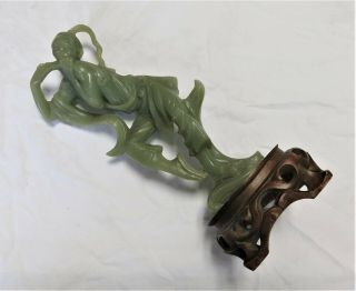 Resin Faux Jade Statue Of Man Playing A Flute On Wooden Base
