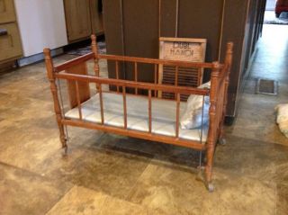 Old Wooden Doll Crib,  On Wheels,  26 " X14 " And Is 18 Inches Tall