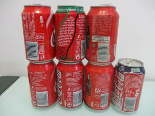 Coca Cola Europe: 7 X empty 330 ml empty cans,  different countries,  90 ' s & on. 3