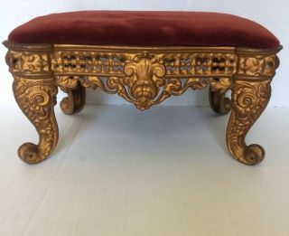 Vintage Gold Toned Cast Iron Foot Stool With Red Velvet Cushion