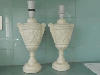 A Large Vintage Embossed Cherub Cream Coloured Table Lamps - 36 Cms Tall